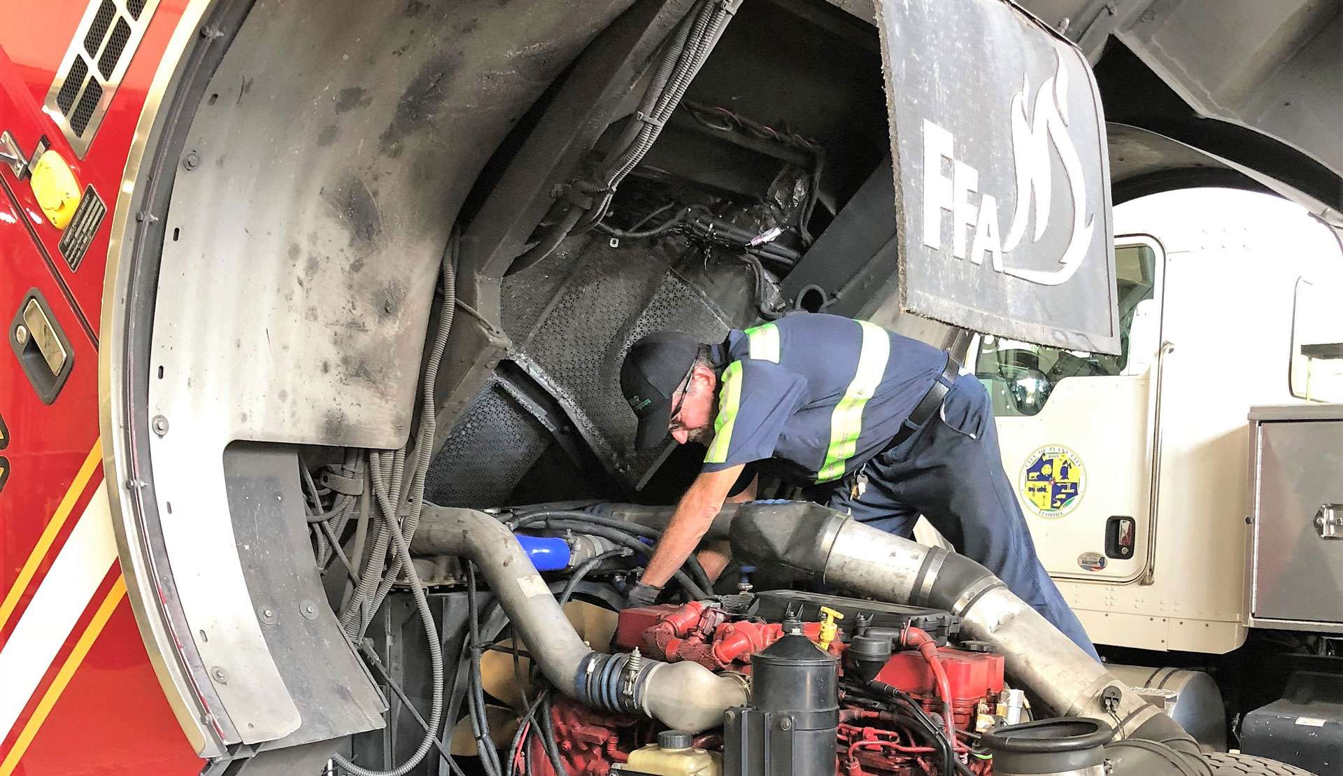 Vector Fleet Management technician working on fire truck